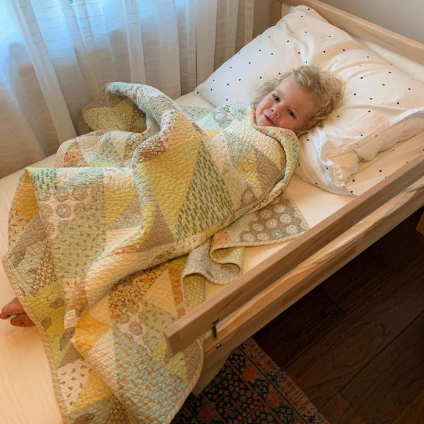 Linzee McCray grandmother post Freya in bed